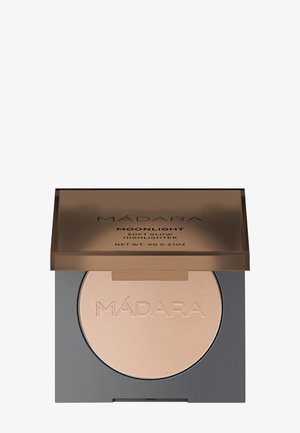 MÁDARA Moonlight Soft Glow Highlighter in a square black compact with a transparent brown lid, featuring a smooth, light beige powder.