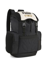 Zaino nero con un risvolto superiore bianco che presenta "PUMA KING" in oro. Include tasche laterali con cerniere e dettagli testurizzati sulle spalline.