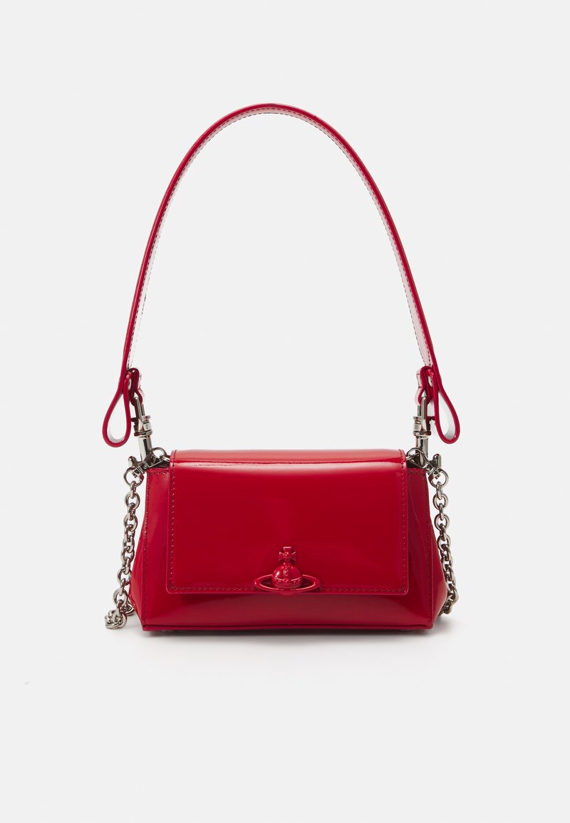 Red patent leather handbag with silver chain accents, a short handle, and a decorative emblem on the front. Compact rectangular shape.