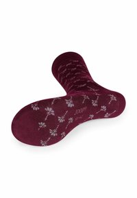 Calzini bordeaux con un motivo floreale in grigio chiaro. Tessuto morbido, lunghezza media a metà polpaccio, punta e tallone rinforzati con dettaglio del logo sulla suola.