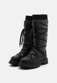 Black padded winter boots with a high shaft, rounded toe, thick rubber sole, and crisscross laces; textured, shiny finish.