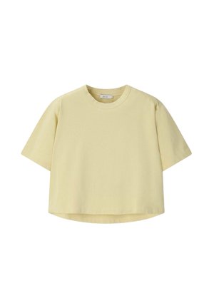 T-shirt court à manches courtes jaune pâle avec un col rond et un ourlet légèrement arrondi.