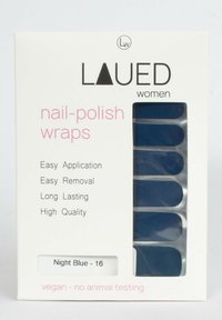 Nail polish wraps in night blue, packaged in a white box with clear window. Features easy application and removal with “vegan” label.