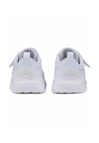 White athletic shoes featuring a mesh upper, padded collar, and contrasting accents. Rounded heel with textured rubber outsole and logo detail.