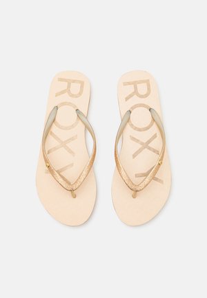 Roxy flip-flops, featuring a beige base with a textured pattern and glittery gold straps, providing a casual and lightweight design.