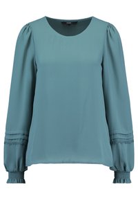 Blouse bleu sarcelle avec un col rond, manches longues bouffantes et poignets froncés. Détail subtil en dentelle le long des manches. Tissu lisse et léger.