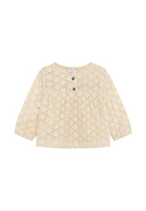 Beige babybloos met lange mouwen, bloemrijke kantstructuur en twee knopen aan de voorzijde van de halslijn.