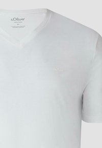 White V-neck cotton T-shirt with short sleeves and small embroidered s.Oliver logo on left chest.