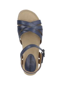 Navy blue sandal with crisscrossed synthetic straps, adjustable buckle, and a cushioned tan footbed. Flat sole for comfort.