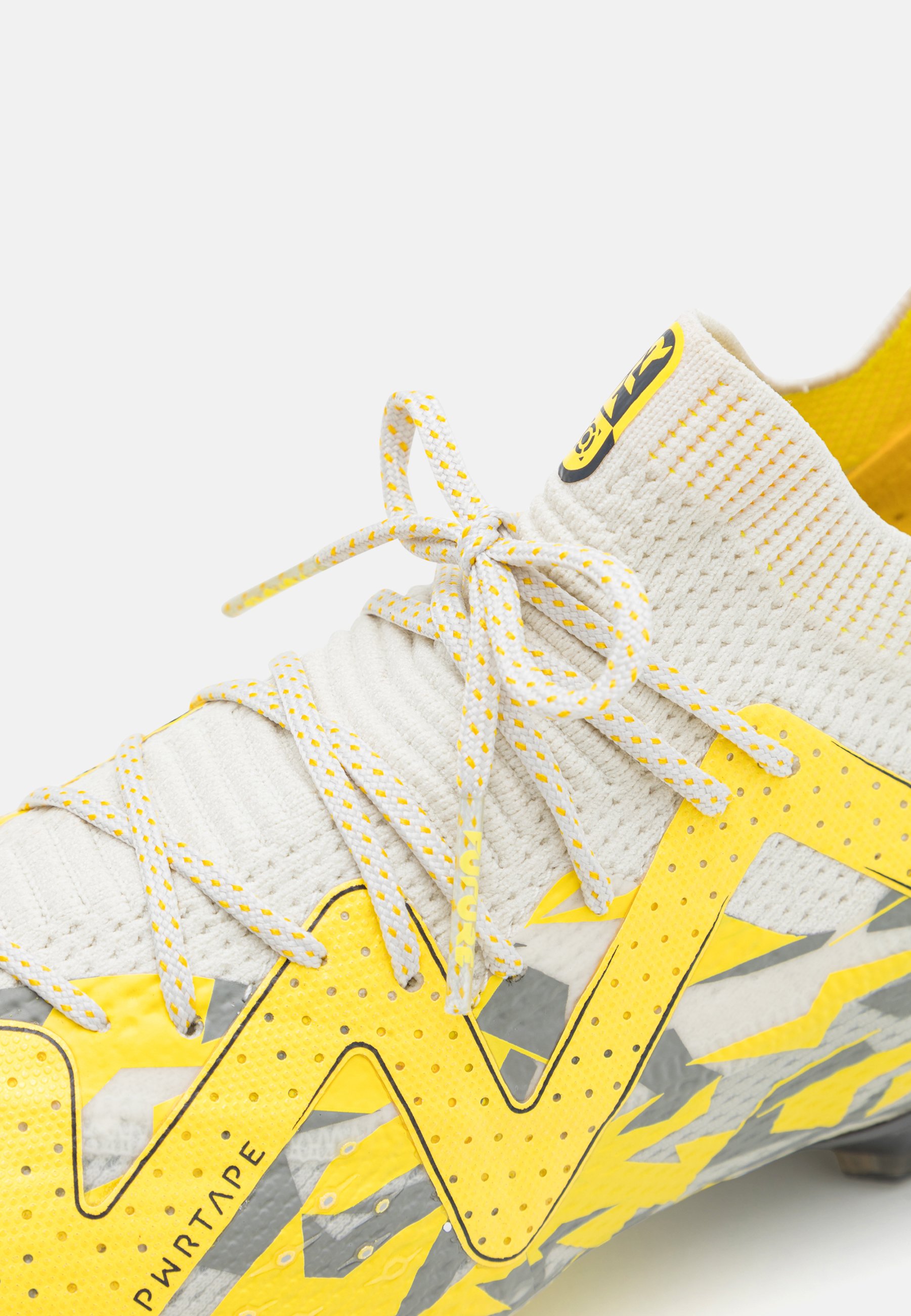 yellow and grey football boots