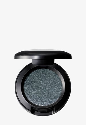 Round black compact with a glossy top. Contains gray-green eyeshadow featuring fine silver shimmer particles. Opened to reveal the product.