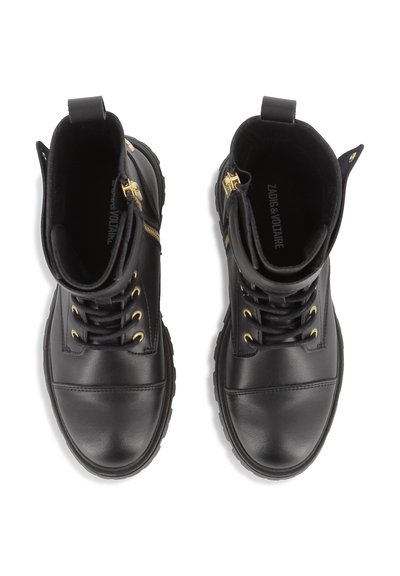 Bottines noires avec une finition en cuir lisse, œillets dorés et fermetures éclair. Présentent un bout rond et une semelle épaisse pour plus de stabilité.