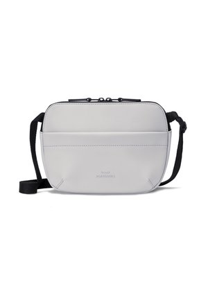 Small light grey crossbody bag with front pocket, black adjustable strap, and top zipper closure.