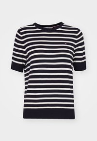 Krátké pruhované pletené tričko námořnické modré a bílé barvy s kulatým výstřihem a logem na hrudi. Měkká látka a žebrovaný lem.