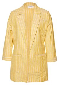 Żółta marynarka w pionowe białe paski, wykonana z lekkiego materiału, z długimi rękawami i dwoma przednimi kieszeniami. Kołnierz z wycięciem i otwarty przód.