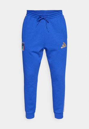 Pantaloni della tuta blu con vita regolabile, con la scritta "Italia" e un logo. Logo Adidas oro sulla coscia sinistra; polsini a costine alle caviglie.