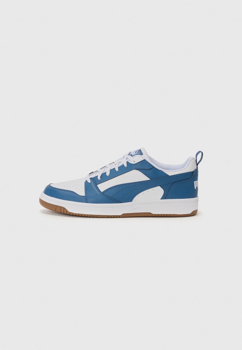 Blue and white sneaker with a rubber sole, leather and synthetic materials, perforated toe, and a logo on the heel. Round laces.