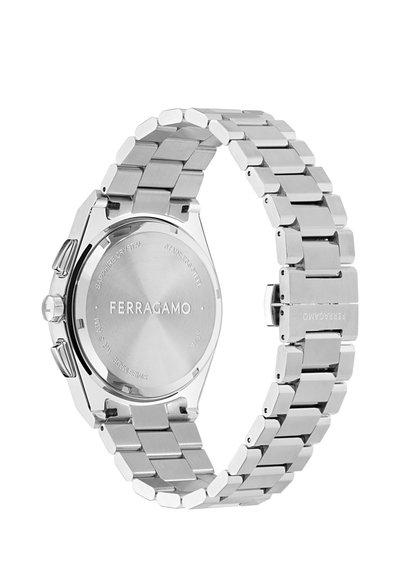Rozsdamentes acél karóra ezüst színű karkötővel és kerek tokkal. Jellemzője a "FERRAGAMO" felirattal ellátott hátlap és a zafírüveg részlet.