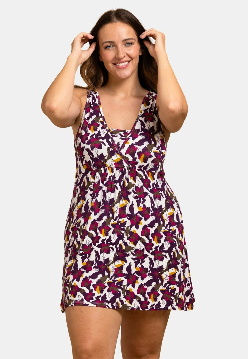 Robe florale avec un décolleté en V profond, sans manches et une taille froncée. Les couleurs incluent le violet, le blanc et le jaune, avec une texture de tissu douce.