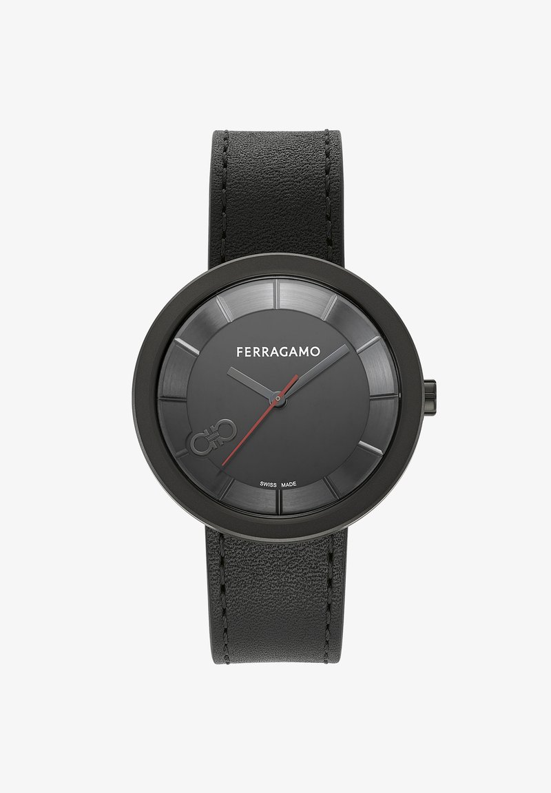 Mustast nahkkäevärviga kell, ümmargune matte must korpus, tekstuurne must kellapind ja kontrastne punane tund käsi. Omab Šveitsi käsitööd.