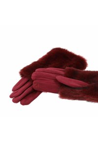 Guanti color marrone scuro con polsino soffice e peloso. I guanti hanno una finitura liscia e presentano quattro dita e un pollice, con dettagli di cucitura sottili.