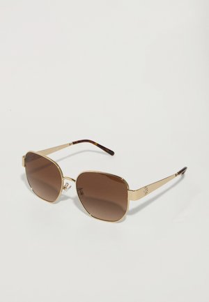 Brown gradient sunglasses with a geometric shape, gold metal frames, and dark tortoiseshell accents on the temples.