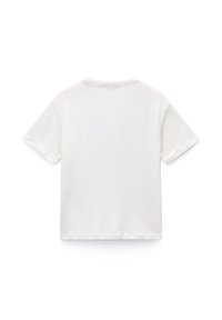 White cotton T-shirt with short sleeves, crew neck, and a relaxed fit. Features a plain design with no visible patterns or accents.