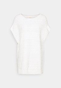 Vit stickad oversized tröja med ett texturerat mönster, rundad halsringning och ribbad nederkant. Kortsleevar och sidofickor förbättrar andningsförmågan.