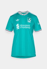 Maillot de football turquoise de Liverpool avec logos blancs, col et poignets de manches rayés noir et blanc, et sponsor "standard chartered" à l'avant.