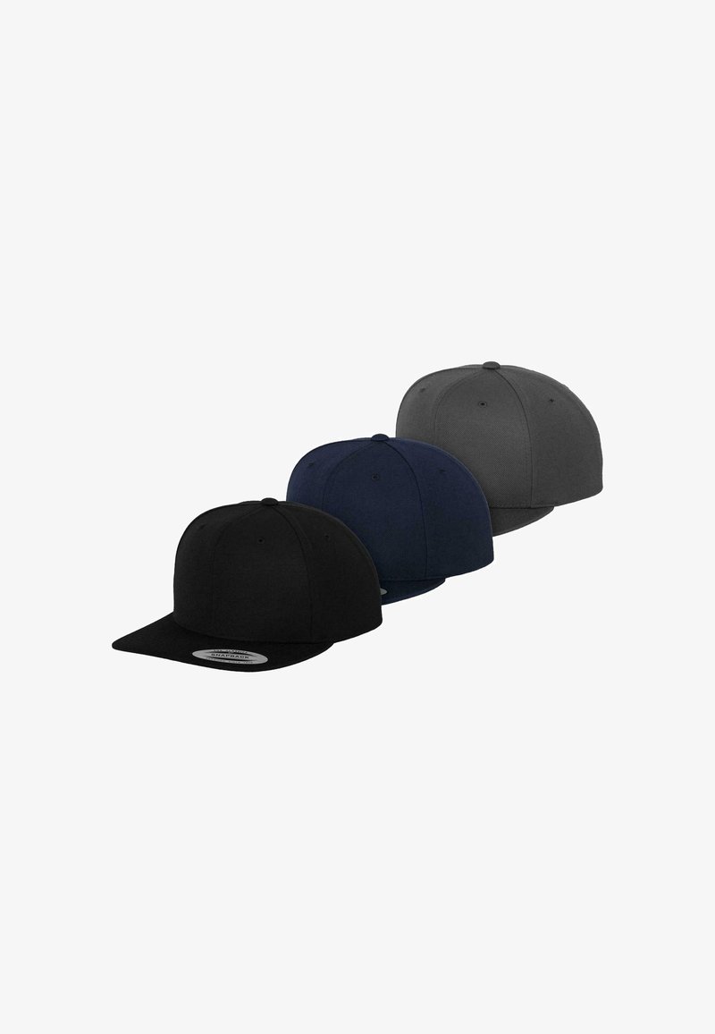 Three baseball caps in black, navy, and gray. Made of fabric, feature flat brims, rounded crowns, and a stitched logo patch on the brim.