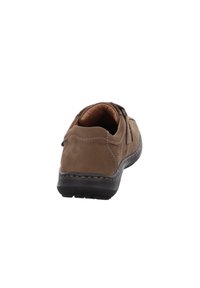 Brown leather shoe with stitched detailing and a textured surface. Rounded back and padded collar. Black rubber sole with traction.