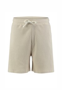 Shorts en tricot texturé beige avec taille élastique et cordon de serrage à l'avant, conçus pour un usage décontracté.