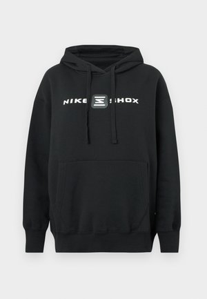 Črni pulover Nike Shox z žepom spredaj in kapuco z vrvico, na prsih z belim logotipom in grafikonom.