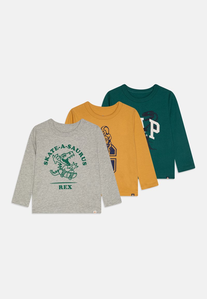 Tri dolgimi rokavi majice: siva z grafiko dinozavra, gorčično rumena z logotipom in temno zelena z vzorčastimi detajli. Bombažna tkanina.