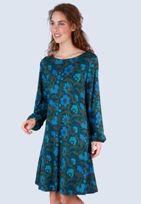 Blumenkleid mit langen Ärmeln, das ein petrol- und marineblaues Muster zeigt, mit lockerer Passform und rundem Ausschnitt. Weicher Stoff mit sanftem Fall.