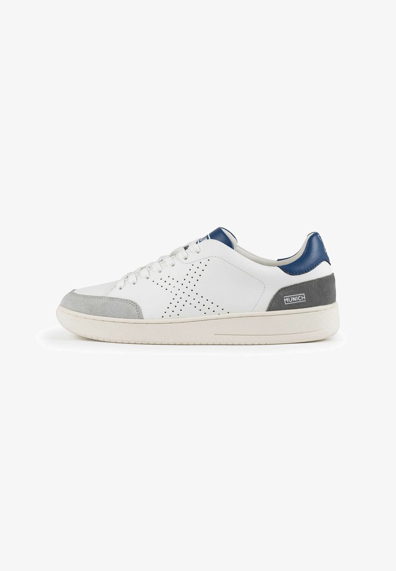White sneaker with grey and navy accents. Features perforated star design, lace closure, and rubber sole. Made from leather and suede materials.