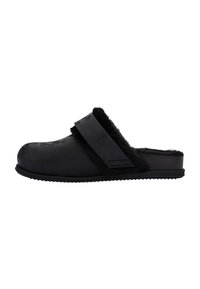 Black clogs feature a soft, fuzzy lining, smooth exterior, and a wide strap across the top. Textured sole provides grip.