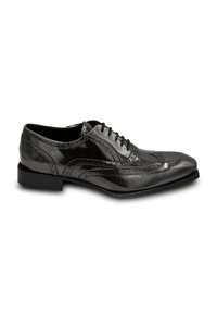 Black leather oxford shoe with a glossy finish, featuring brogue detailing, a rounded toe, and a low heel. Laced design with decorative perforations.