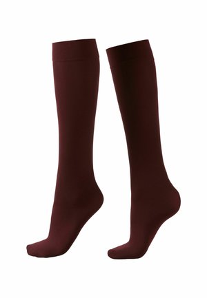 Calcetines burdeos hasta la rodilla hechos de una tela suave y elástica, con secciones de puntera y talón reforzadas, que presentan un borde superior acanalado.