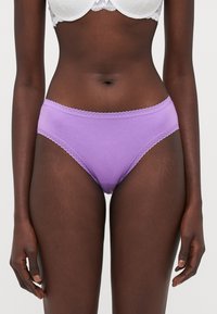 Purple cotton brief with lace trim along the waistband. Smooth texture, mid-rise cut, and minimalistic design.