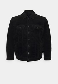 Chaqueta de pana negra con botones en la parte delantera, dos bolsillos en el pecho y un cuello. Color sólido, tejido texturizado, mangas largas y diseño ajustado.