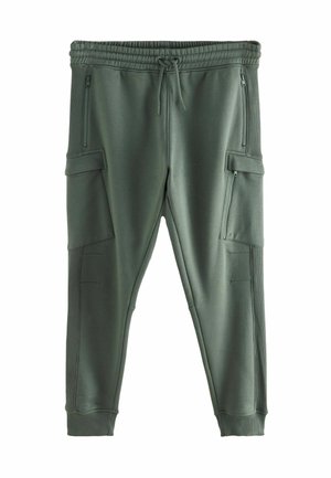 Green athletic pants made of smooth fabric, featuring zippered side pockets, ribbed waistband, and tapered cuffs.