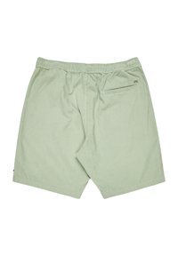 Lichtgroene shorts met een gestructureerde afwerking. Voorzien van een elastische tailleband en een enkele achterzak met rits.