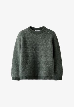 Roheline kudumine särk ümmarguse kaelusega, ribidega ääred ja mansetid. Tekstureeritud kangas pehme viimistlusega, millel on mugav lõige.