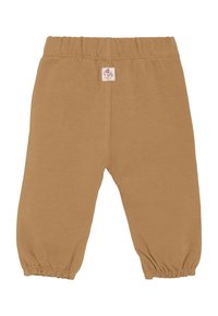 Bruine peuterbroek met elastische tailleband, opgestikte manchetten en een klein wit label met roze lettering in het midden van de voorste tailleband.