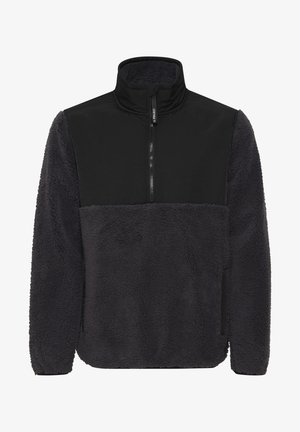 Fleece pullover with a high collar. Features a black upper panel and a textured dark gray lower section. Includes a front zipper and side pockets.