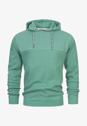 Hanorac verde dintr-un material texturat, cu un model cu nervuri, glugă cu șnur și design cu bloc de culoare solidă pe piept și mâneci.