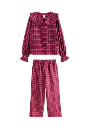 Red and pink plaid pajama set featuring a button-up shirt with a large collar and elastic waistband pants with ruffled cuffs.