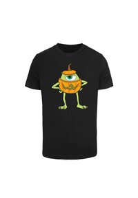 Black t-shirt featuring a cartoon character with a pumpkin body, one eye, green arms, and claws. Pumpkin has a carved facial expression and stem.
