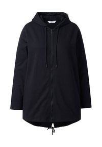 Chaqueta de sudadera negra con cremallera frontal, capucha ajustable con cordón y bajo con cordón. Presenta mangas largas y un corte holgado.